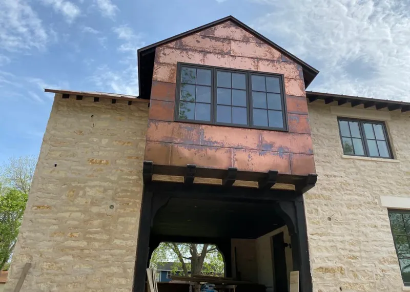 Copper metal panel facade on a stone building for Roof Repair in Palo Alto