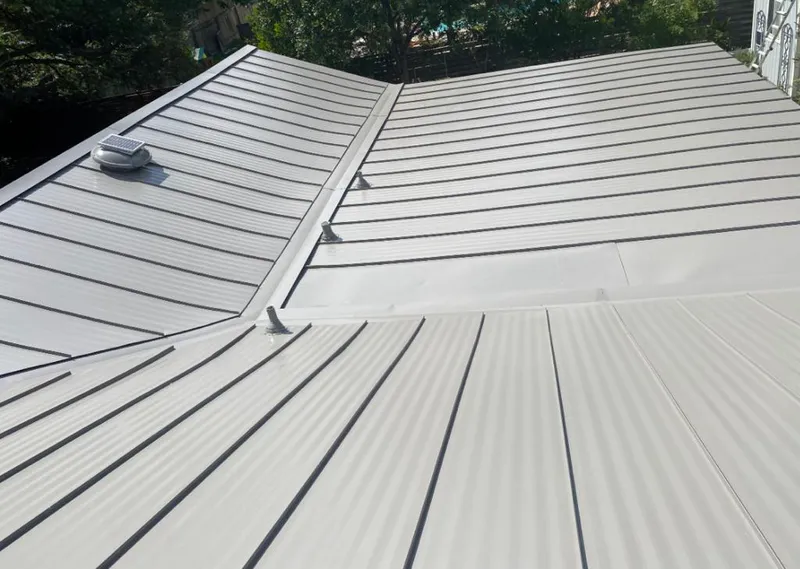 Solar attic fan installed on a metal roof for Roof Ventilation in Palo Alto
